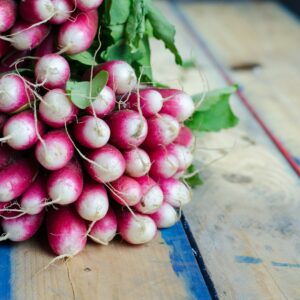 purple and white vegetables on brown surface